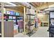 Unfinished basement area with exposed ceiling, storage shelves, and ample room for customization at 9900 Hunt Club Way, Johns Creek, GA 30022