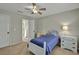 Comfortable bedroom features a ceiling fan, neutral walls, and stylish decor at 9900 Hunt Club Way, Johns Creek, GA 30022