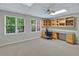 Bright bedroom showcasing a built-in desk and shelving, perfect for a home office or study area at 9900 Hunt Club Way, Johns Creek, GA 30022