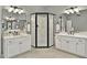 Stylish main bathroom featuring dual vanity, white cabinets, walk-in shower at 9900 Hunt Club Way, Johns Creek, GA 30022