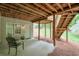 Covered patio with stairs leading to the backyard at 9900 Hunt Club Way, Johns Creek, GA 30022