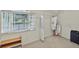 Spacious walk-in closet featuring large window and hanging racks at 9900 Hunt Club Way, Johns Creek, GA 30022