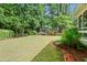Lush backyard featuring a swing set and play area, perfect for outdoor fun and relaxation at 1518 Rochelle Dr, Atlanta, GA 30338