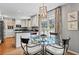 Charming breakfast nook area with round glass table, and bright windows at 1518 Rochelle Dr, Atlanta, GA 30338