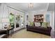 Bright living room featuring a sofa, rug, and doors to an outdoor space at 1518 Rochelle Dr, Atlanta, GA 30338