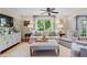 Bright living room with neutral colors, comfortable seating, and large windows providing natural light at 1518 Rochelle Dr, Atlanta, GA 30338