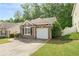 Beautiful single-story brick home with an attached garage and lush greenery enhancing its curb appeal at 171 Nacoochee Way, Canton, GA 30114