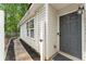Charming front entrance of a home featuring a walkway, neutral siding, and a welcoming front door at 171 Nacoochee Way, Canton, GA 30114