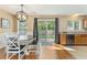 Cozy dining area seamlessly connected to the kitchen, featuring stainless appliances and backyard view at 171 Nacoochee Way, Canton, GA 30114