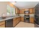 Well-equipped kitchen with stainless steel appliances, a sink, and ample counter space for meal preparation at 171 Nacoochee Way, Canton, GA 30114