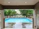 Framed view of the community pool, showcasing a serene and inviting outdoor space at 171 Nacoochee Way, Canton, GA 30114