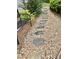 Backyard stone path surrounded by lush foliage at 178 Mission Oak Dr, Grayson, GA 30017