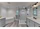 Modern bathroom with a glass-enclosed shower, soaking tub, and double vanity at 178 Mission Oak Dr, Grayson, GA 30017