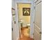 Charming half bathroom with hardwood floors and elegant decorative touches at 178 Mission Oak Dr, Grayson, GA 30017