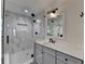 Bathroom featuring a glass shower with marble surround, and a modern vanity at 178 Mission Oak Dr, Grayson, GA 30017