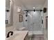 Modern bathroom features a sleek vanity and a tiled shower with glass doors at 178 Mission Oak Dr, Grayson, GA 30017