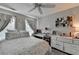Relaxing bedroom features carpeted floors, a ceiling fan, and a study area by the window at 178 Mission Oak Dr, Grayson, GA 30017