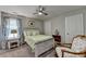 Cozy bedroom with a full bed, carpet, and a rocking chair at 178 Mission Oak Dr, Grayson, GA 30017