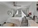 Comfortable bedroom features carpeted floors, a ceiling fan, and a desk area by the window at 178 Mission Oak Dr, Grayson, GA 30017
