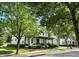 A charming house with large green trees in a Gathering-friendly neighborhood setting at 178 Mission Oak Dr, Grayson, GA 30017