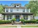 Charming two-story home with a covered front porch and landscaped front yard, perfect for relaxing outdoors at 178 Mission Oak Dr, Grayson, GA 30017