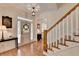 Inviting foyer with hardwood floors, a staircase, and a glimpse of the front door at 178 Mission Oak Dr, Grayson, GA 30017