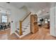 Elegant foyer with hardwood floors, staircase, and an open view into the living spaces at 178 Mission Oak Dr, Grayson, GA 30017