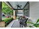 Relaxing front porch with wicker furniture, ceiling fan, and view of the tree-lined street at 178 Mission Oak Dr, Grayson, GA 30017