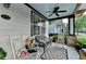 Charming front porch with rocking chairs, a cozy bench, and a welcoming atmosphere at 178 Mission Oak Dr, Grayson, GA 30017