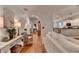 Bright hallway leading to living areas with modern decor and hardwood floors at 178 Mission Oak Dr, Grayson, GA 30017
