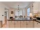 Kitchen island with dark countertop and view to dining area at 178 Mission Oak Dr, Grayson, GA 30017