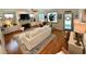 Bright living room with hardwood floors and a fireplace at 178 Mission Oak Dr, Grayson, GA 30017