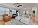 Inviting living room features a white couch, area rug, natural light, and neutral décor at 178 Mission Oak Dr, Grayson, GA 30017