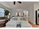 Open-concept living room with white couch, leather chairs, and stylish décor at 178 Mission Oak Dr, Grayson, GA 30017