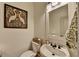 Elegant powder room with a swan art piece and decorative mirror at 178 Mission Oak Dr, Grayson, GA 30017