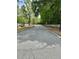 Serene street view of a tree-lined road with white fences at 178 Mission Oak Dr, Grayson, GA 30017