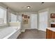 Bathroom with tub and shower, neutral walls and decor at 3133 Bridge Walk Dr, Lawrenceville, GA 30044