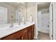 Bathroom with double sink vanity, large mirror, and tub shower at 3133 Bridge Walk Dr, Lawrenceville, GA 30044