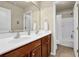 Bathroom with double sink vanity, large mirror, and tub shower at 3133 Bridge Walk Dr, Lawrenceville, GA 30044