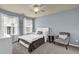 Bedroom featuring a bed with blue walls and large windows at 3133 Bridge Walk Dr, Lawrenceville, GA 30044