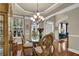 Charming dining room featuring a glass table, elegant chairs, and natural light at 3133 Bridge Walk Dr, Lawrenceville, GA 30044