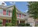 Close-up of a home's exterior with stone accents and red shutters, highlighting its curb appeal at 3133 Bridge Walk Dr, Lawrenceville, GA 30044
