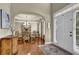 Elegant foyer with hardwood floors, a white front door, and a view into the dining room at 3133 Bridge Walk Dr, Lawrenceville, GA 30044