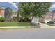 Inviting front yard view of a two-story home with manicured lawn and charming curb appeal at 3133 Bridge Walk Dr, Lawrenceville, GA 30044
