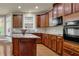 Well-equipped kitchen boasts stainless appliances, granite counters, and ample cabinet space, perfect for culinary enthusiasts at 3133 Bridge Walk Dr, Lawrenceville, GA 30044