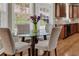Eat-in kitchen features hardwood floors, wooden cabinets, stainless steel appliances, and natural light at 3133 Bridge Walk Dr, Lawrenceville, GA 30044