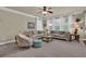 Comfortable living room with neutral tones, plush seating, and ample natural light from large windows at 3133 Bridge Walk Dr, Lawrenceville, GA 30044