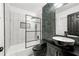 Modern bathroom featuring a bathtub with shower, decorative tile walls, and stylish black fixtures at 4158 Pepperdine Dr, Decatur, GA 30034