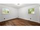 Bright bedroom with hardwood floors and large windows providing ample natural light at 4158 Pepperdine Dr, Decatur, GA 30034