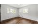 A bedroom bathed in natural light offers sleek wood-look flooring and serene white walls at 4158 Pepperdine Dr, Decatur, GA 30034